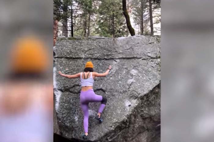 Mulher escala parede de pedra sem usar as mãos 