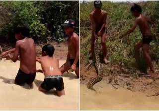 Crianças se divertem com cobra gigante no Camboja