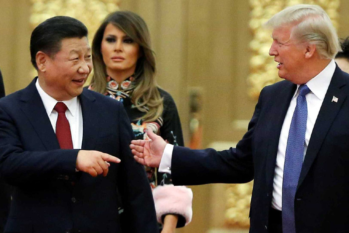No Vietnã, Trump critica comércio mundial e China defende globalização