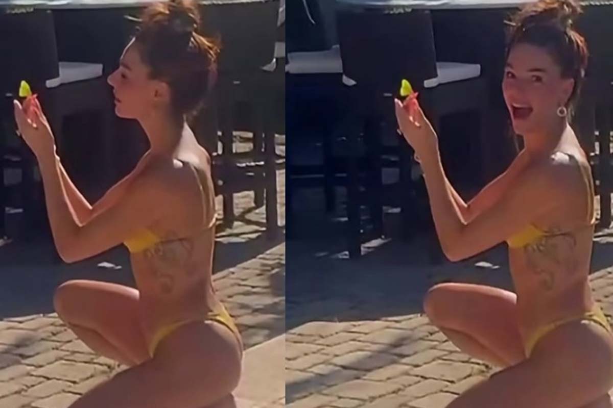Isis Valverde exibe boa forma com biquíni cavado em dia de sol